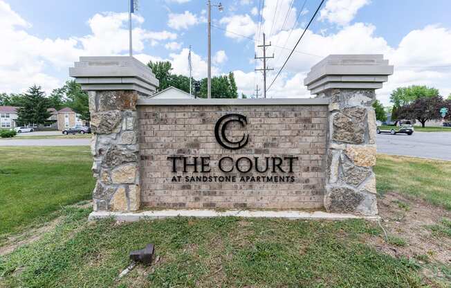 the court at banning apartments entrance sign