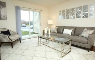 Living Room With Private Balcony at Withington Apartments, MRD Apartments, Jackson, MI, 49201