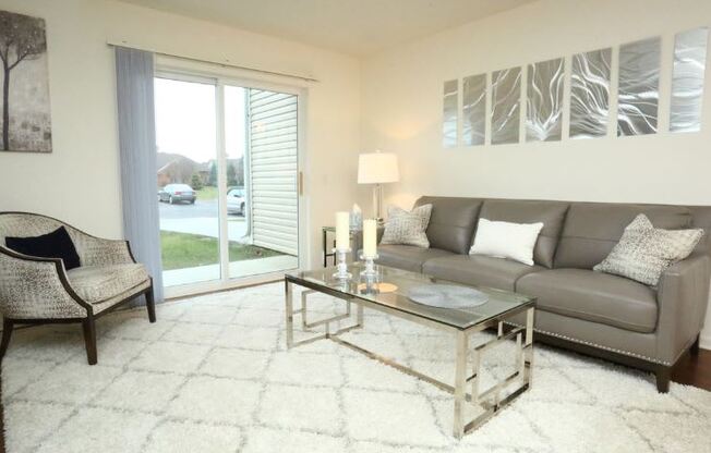 Living Room With Private Balcony at Withington Apartments, MRD Apartments, Jackson, MI, 49201
