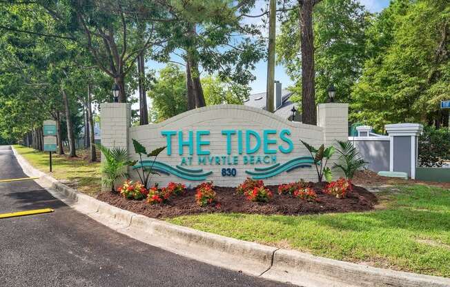 the tides sign at the entrance to the tidelands park