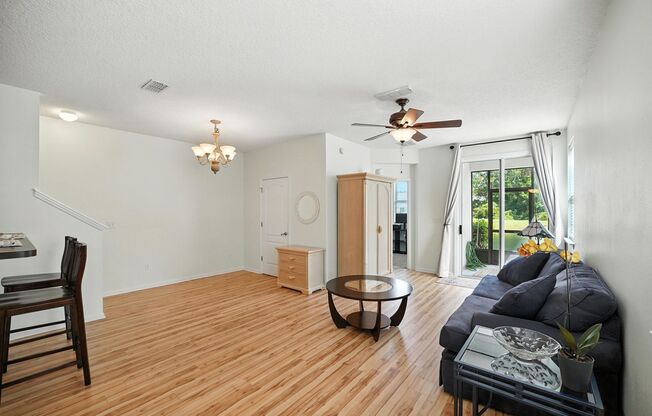 Immaculate three-bedroom, three-bath end-unit townhome showcasing upgrades throughout.