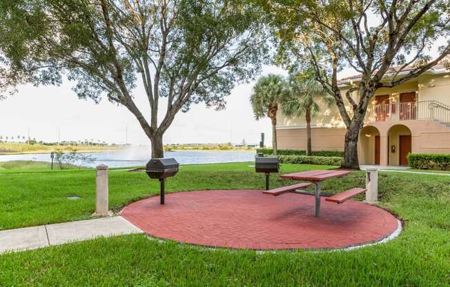 Grilling Area with Pond Views at Windsor at Miramar, Miramar, Florida