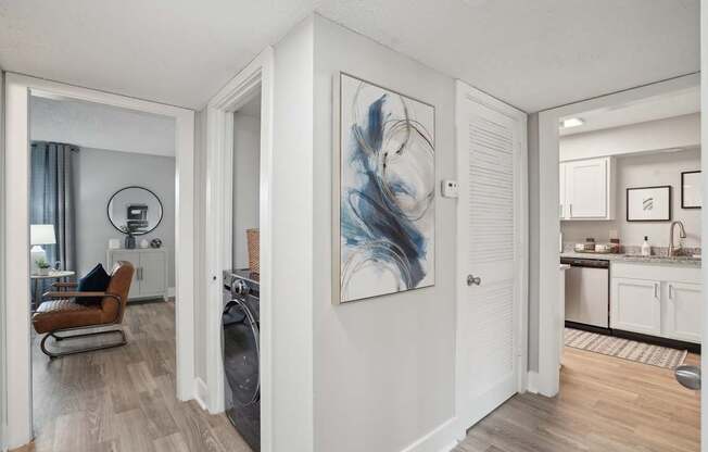Open-concept living room with natural light and wood-style flooring in a Hendersonville apartment