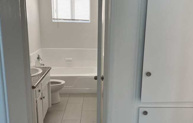 Nice white bathroom with natural light in apartment at The Carlton in Hollywood, California.