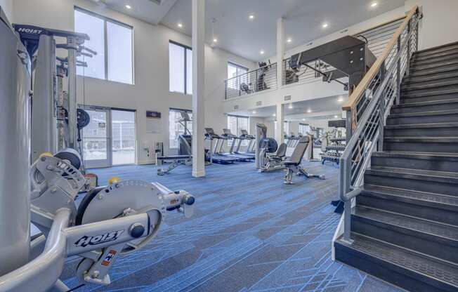 the gym at the flats at obsidian tower has cardio equipment and stairs