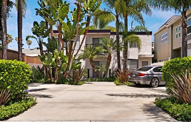 One of Kind 2/2 ! GARAGE with EV Charger  + Add Parking, AC, WD in unit  Walk to BEACH and BAY. Private Patio