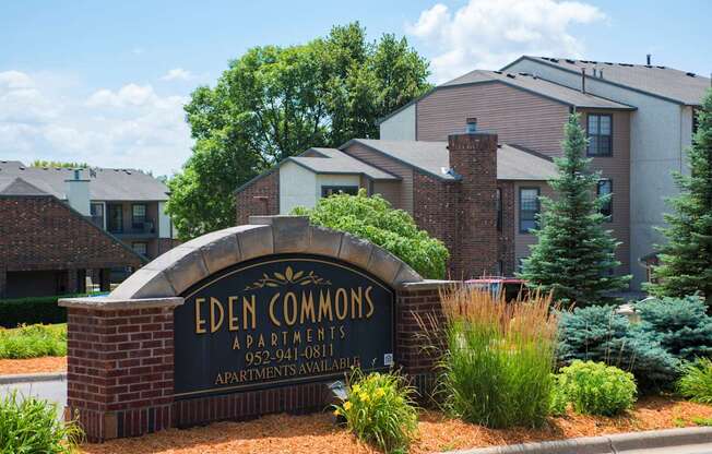 The image shows a sign for Eden Commons apartments with a phone number and a note that apartments are available.