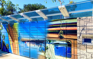 a bathroom with a colorful mural on the side of it at La Jolla Blue, San Diego, 92122