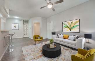 a living room with a couch and a ceiling fan at Foxborough Apartments, Irving, TX, Texas, 75061