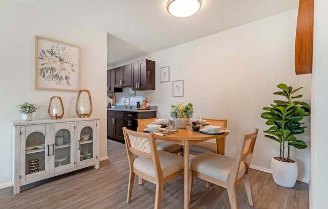 a dining room with a table and chairs