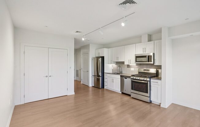 Kitchen with white cabinets and stainless steel appliances at Park77 Apartments, Cambridge, Massachusetts, 02138