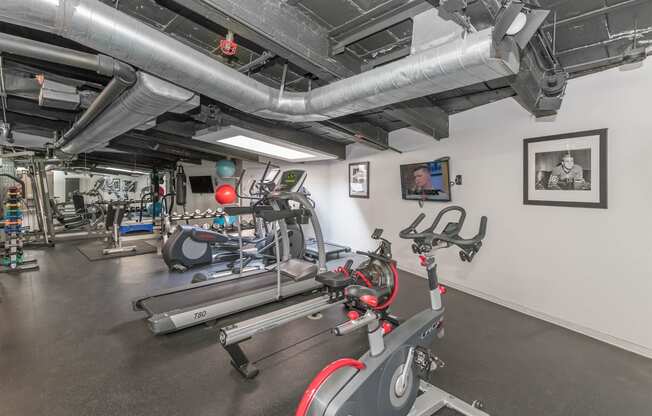 the gym at the district at highland village apartments