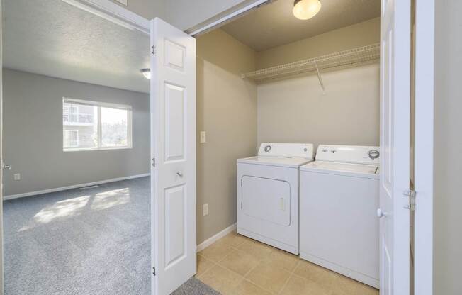 A laundry room with a washer and dryer.