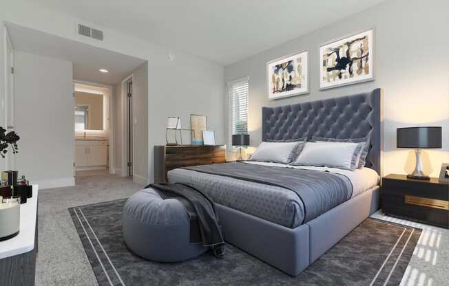 a bedroom with a bed and a dresser in a room at Laguna Gardens Apts., California
