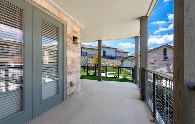 the private balcony has views of the yard and the house