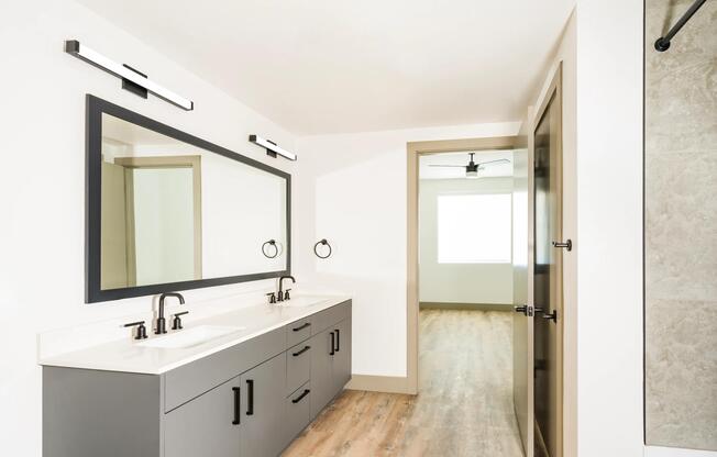 A spacious primary bath with dual vanities, clean finishes, and room to start and end your day with ease.