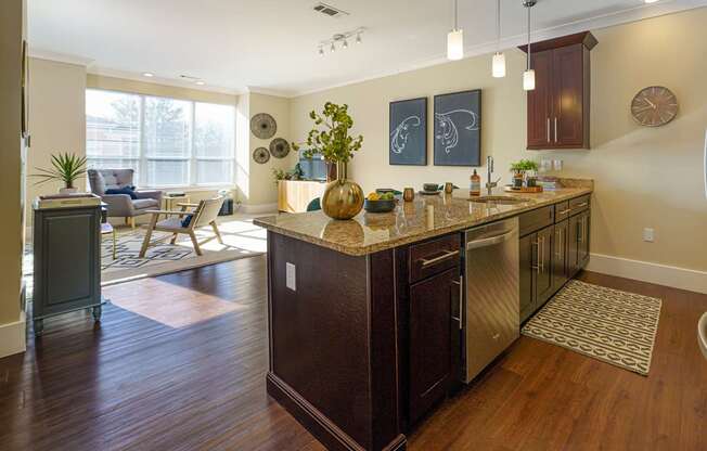 A kitchen with a wooden floor and a large island.