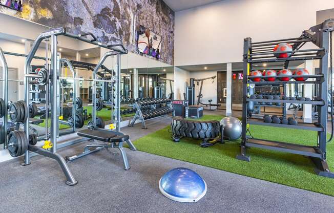 24 hour athletic center with weights and other exercise equipment at Zeta Luxury Apartments in Sacramento, CA
