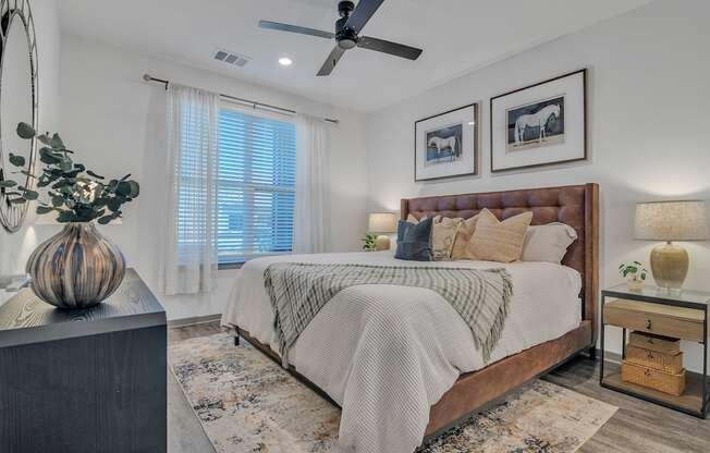 a bedroom with a large bed and a ceiling fan at Canter, Florida