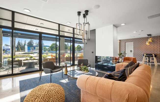A modern living room with a large window overlooking a cityscape.