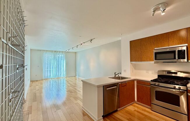 1BR + Den / 1BA with Private Patio + Parking!