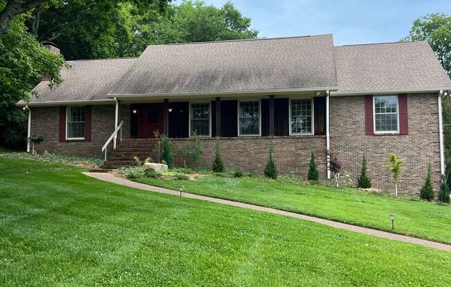 Single Family Home on almost an acre, 4 beds, 3 baths, Front Porch, Great Storage Space, and Great Yard