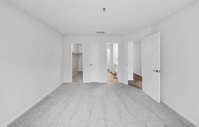 A long, empty hallway with doors on both sides.