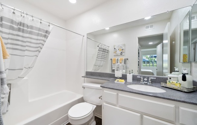 a bathroom with a sink toilet and a shower