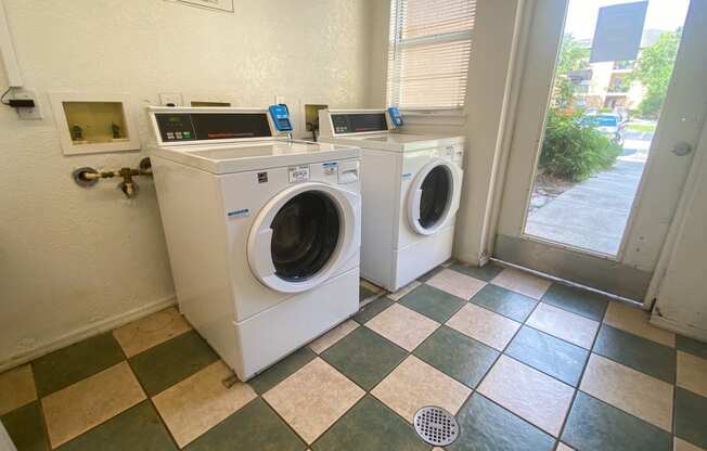 Clothing care center with washers, dryers, and folding station