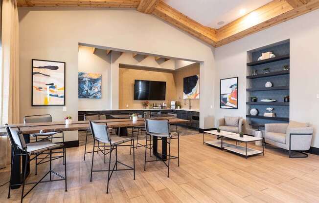 A modern living room with a wooden floor and a large dining table.