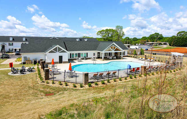 A sweeping view of the apartment community's clubhouse, zero entry pool and other amenities.