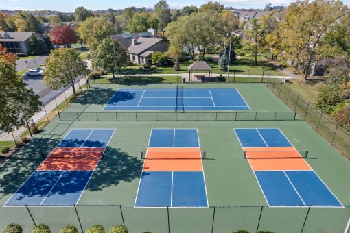 an aerial view of the tennis courts on the neighbourhood neighbourhood tennis court