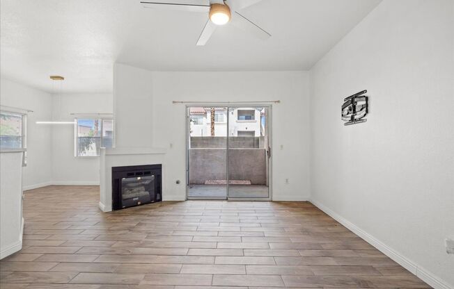 Charming 2-Bedroom First Floor Featuring Open Layout, Fireplace, Patio & Community Pool