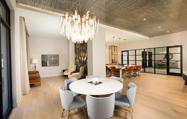 The thoughtfully designed dining and lounge space at Modera Liberty Row offers an inviting setting for shared meals, gatherings, and everyday connection.