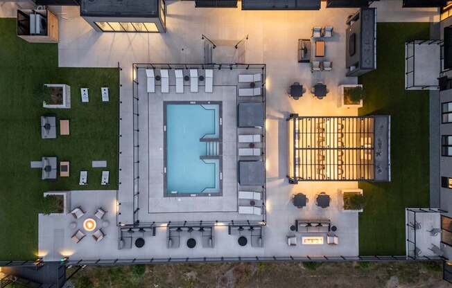 A modern house with a pool and a patio area.