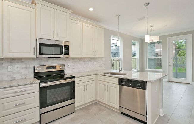4 Bedroom 3.5 bath Beauty in Just a Short Stroll to Jax Beach - Garage, Lawncare Included & Fenced in Back Yard!