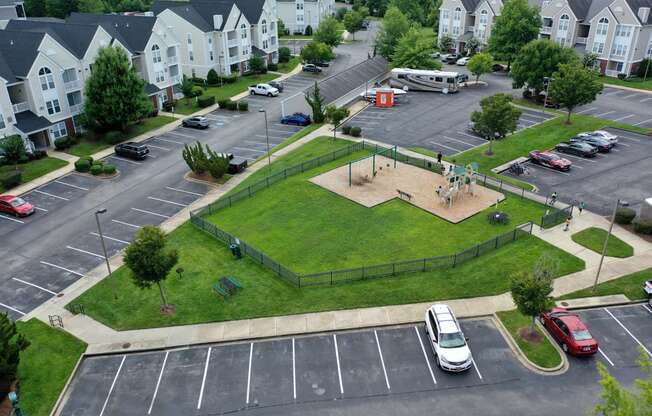 an aerial view of a park with a basketball court
