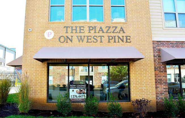 The Piazza on West Pine is a building with a sign on it.