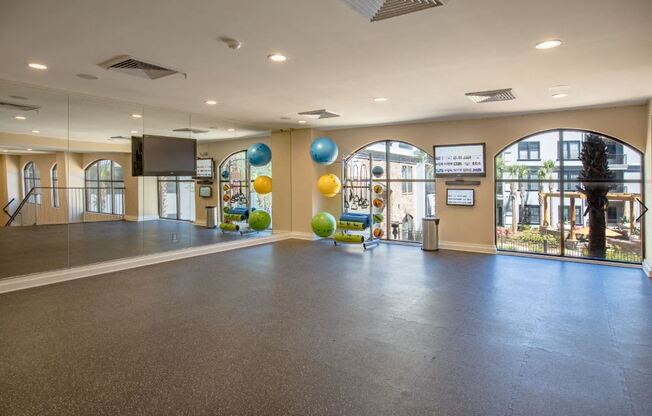 2nd floor of Fitness Center with wall to wall mirror and WellBeats virtual trainer. Exercise balls and yoga mats available.