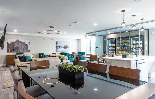 A modern dining area with a glass table and chairs.