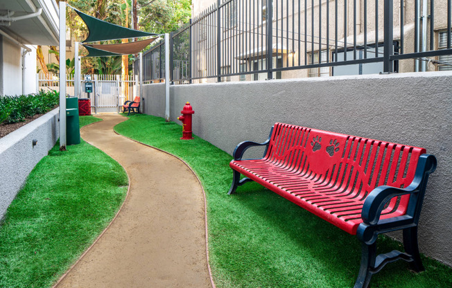 Apartments For Rent In Miracle Mile Los Angeles, CA - The Preston Miracle Mile - Gated Dog Park With Lush Green Grass, Fire-Hydrant, Clean-Up Area, And Benches