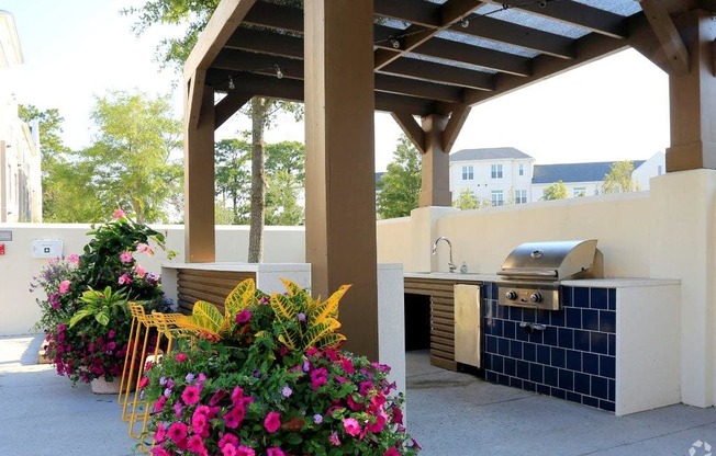 Poolside kitchen with grills at Link Apartments® Mixson, North Charleston, SC