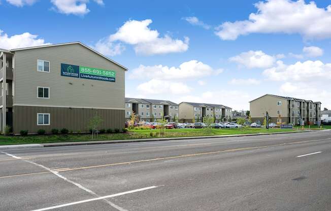 an empty street with an apartment building on the side of it