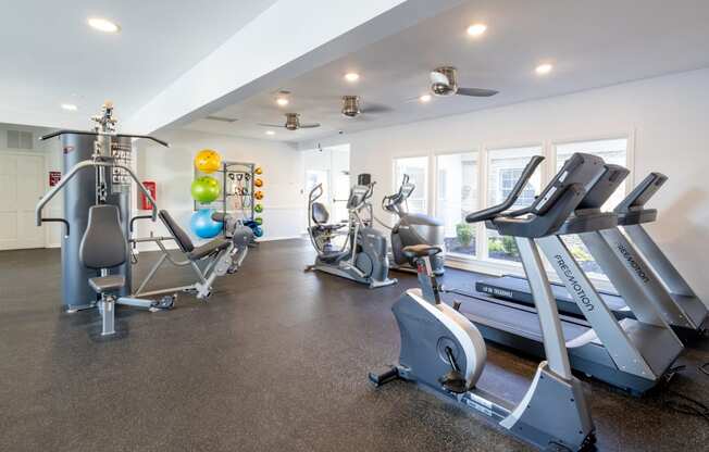 the gym with treadmills and other exercise equipment at the flats at chev