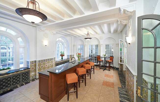 Spanish room with tile floor, long bar top with four chairs at Residences at Forest Park, Saint Louis, 63108