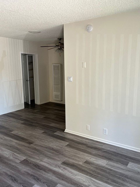 Front room view of dining area with ceiling fan in apartment at Los Robles in Pasadena, California.