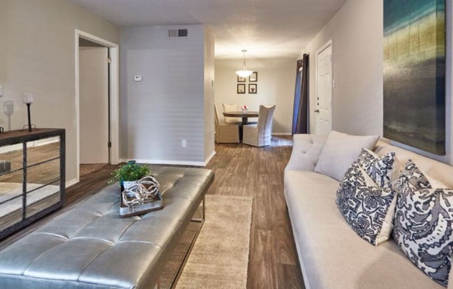 a living room with a couch and a table in the background