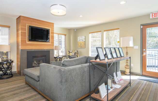 a living room with a couch and a fireplace