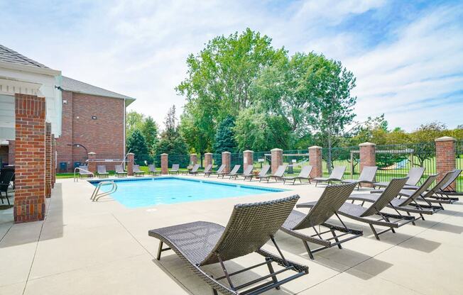 Swimming pool with lounge chairs for sunbathing
