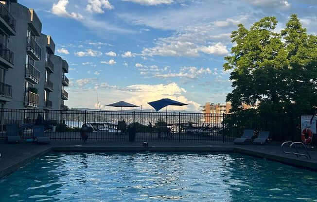 Updated 2-Bedroom Condo with Water Views, 2 Parking Spaces & Poolside Location
